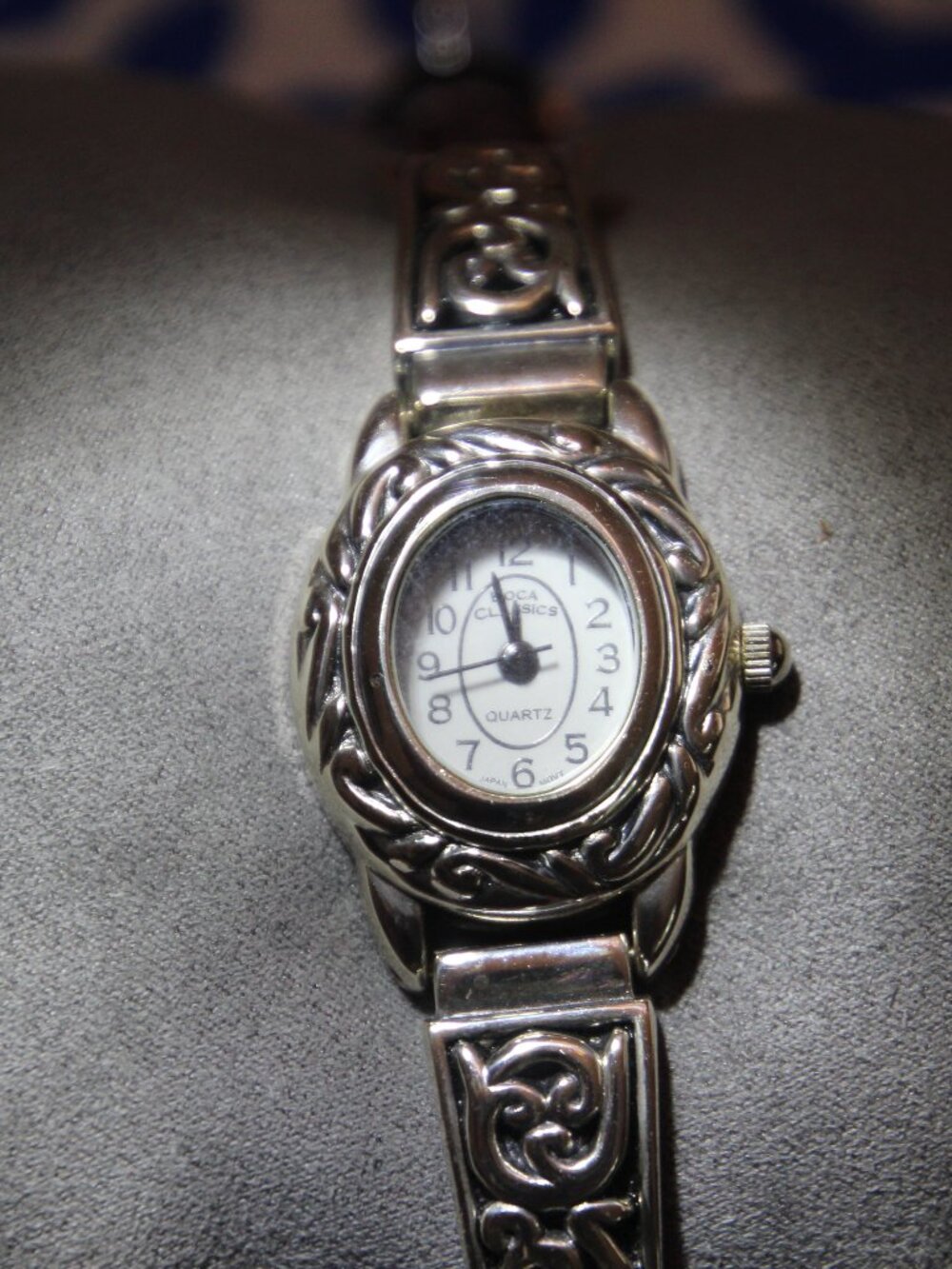 Watch, silver tone with brown adjustable band. Boca Classics brand. Used.